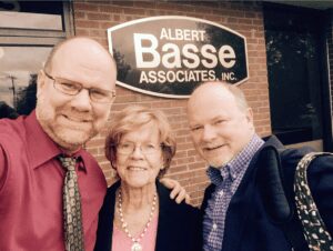 Photo of Albert "Chip" Basse, Edwin "Ed" Basse, and mother Ellen Basse in the 90's after Chip takes over as CEO of Albert Basse Associates in Stoughton, MA